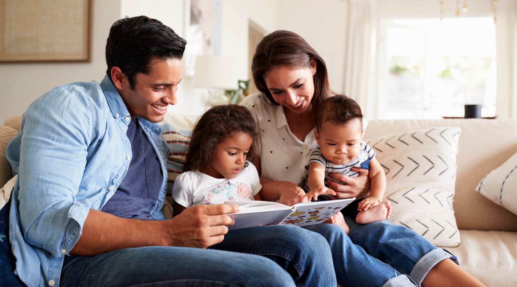 lifestyle image of a family in a bright living room